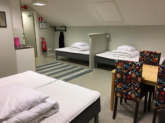 Apartment with four beds and a small kitchen at Mini-Hotel Borås